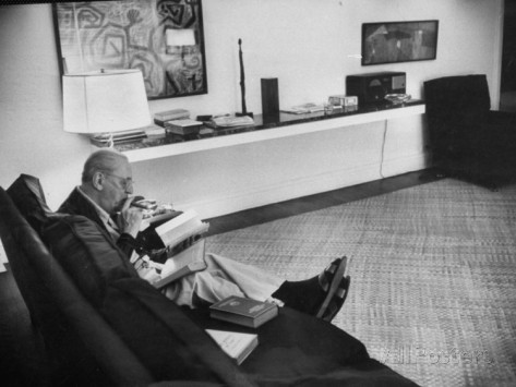 architect-mies-van-der-rohe-relaxing-on-couch-while-smoking-cigar-and-reading-at-home